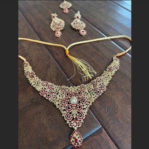 red and gold kundan set